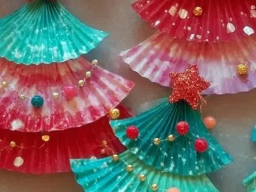 Kids making homemade Christmas DIY ornaments for holiday decorations