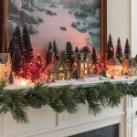 Beautiful DIY Christmas village display showcasing festive decorations and miniature houses.