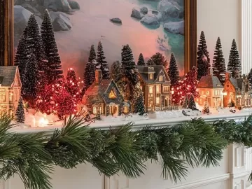 Beautiful DIY Christmas village display showcasing festive decorations and miniature houses.