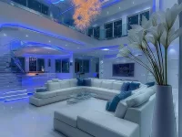 Luxurious modern glam living room with elegant gold accents, plush seating, marble details, and sophisticated lighting in a stylish contemporary interior