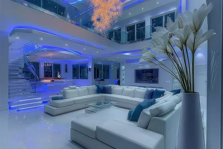 Luxurious modern glam living room with elegant gold accents, plush seating, marble details, and sophisticated lighting in a stylish contemporary interior