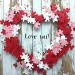 DIY Valentine wreath decorated with hearts and flowers for romantic decor