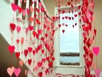 Various Valentine's Paper Heart Crafts displayed on a colorful background.