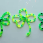 Colorful beaded shamrocks made from pipe cleaners for festive decoration