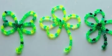 Colorful beaded shamrocks made from pipe cleaners for festive decoration