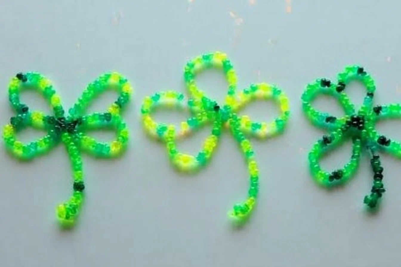 Colorful beaded shamrocks made from pipe cleaners for festive decoration